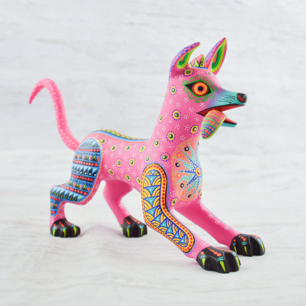 magiamexica.com-Colorful Mexican alebrije of Dante from Disney's Coco, inspired by Día de Muertos, featuring intricate designs and vibrant colors that celebrate traditional Mexican art and culture.