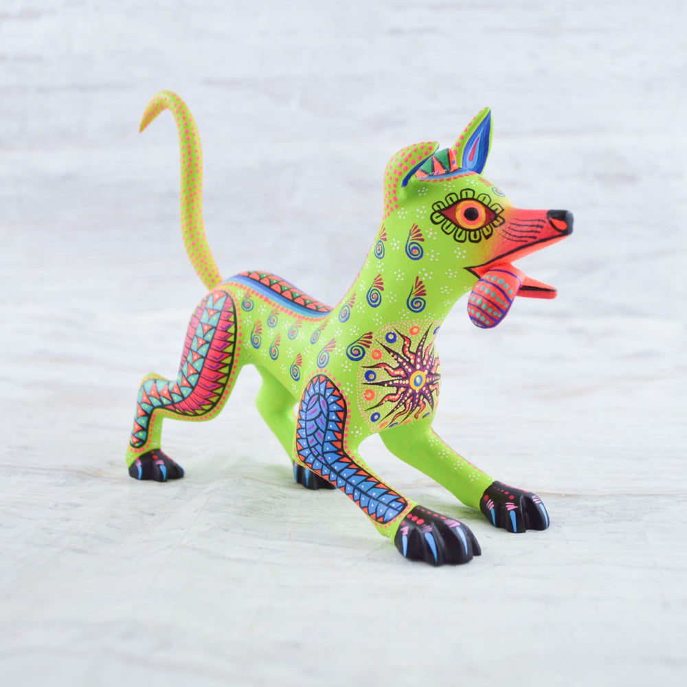 magiamexica.com-Colorful Mexican alebrije of Dante from Disney's Coco, inspired by Día de Muertos, featuring intricate designs and vibrant colors that celebrate traditional Mexican art and culture.