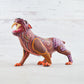 magiamexica.com - Vivid Mexican alebrije shaped like a jaguar, intricately carved and painted with bright colors and detailed patterns, reflecting traditional folk art